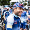 Cadel Evans is smiling and wearing his Great Ocean Road Race Cycling Cap